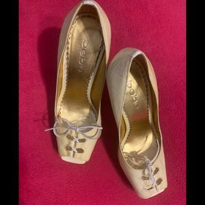 Wow BEBE, beige all leather peep toe 5 inch heels.  Perfect Halloween accessory.